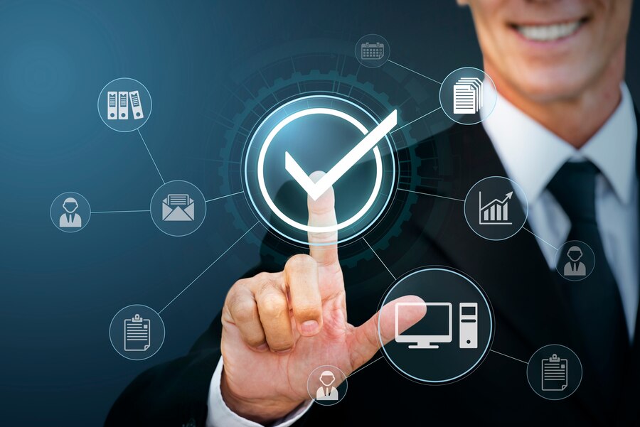 Man in suit smiling while touching the screen